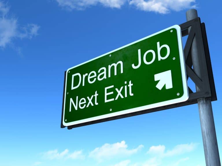a street sign that reads "dream job next exit"